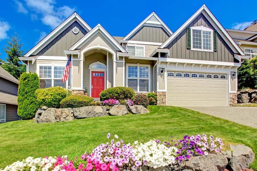 Home-Insurance-Family-Home-with-a-Red-Door-and-American-Flag-Outside
